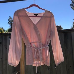 Pale pink velvet wrap style top.